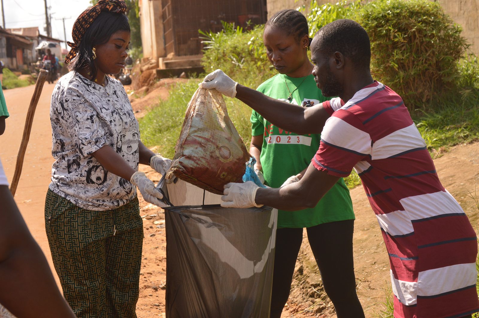 CRAF volunteers and community participants collecting waste during the World Environment Day clean-up exercise in Soul Clinic.