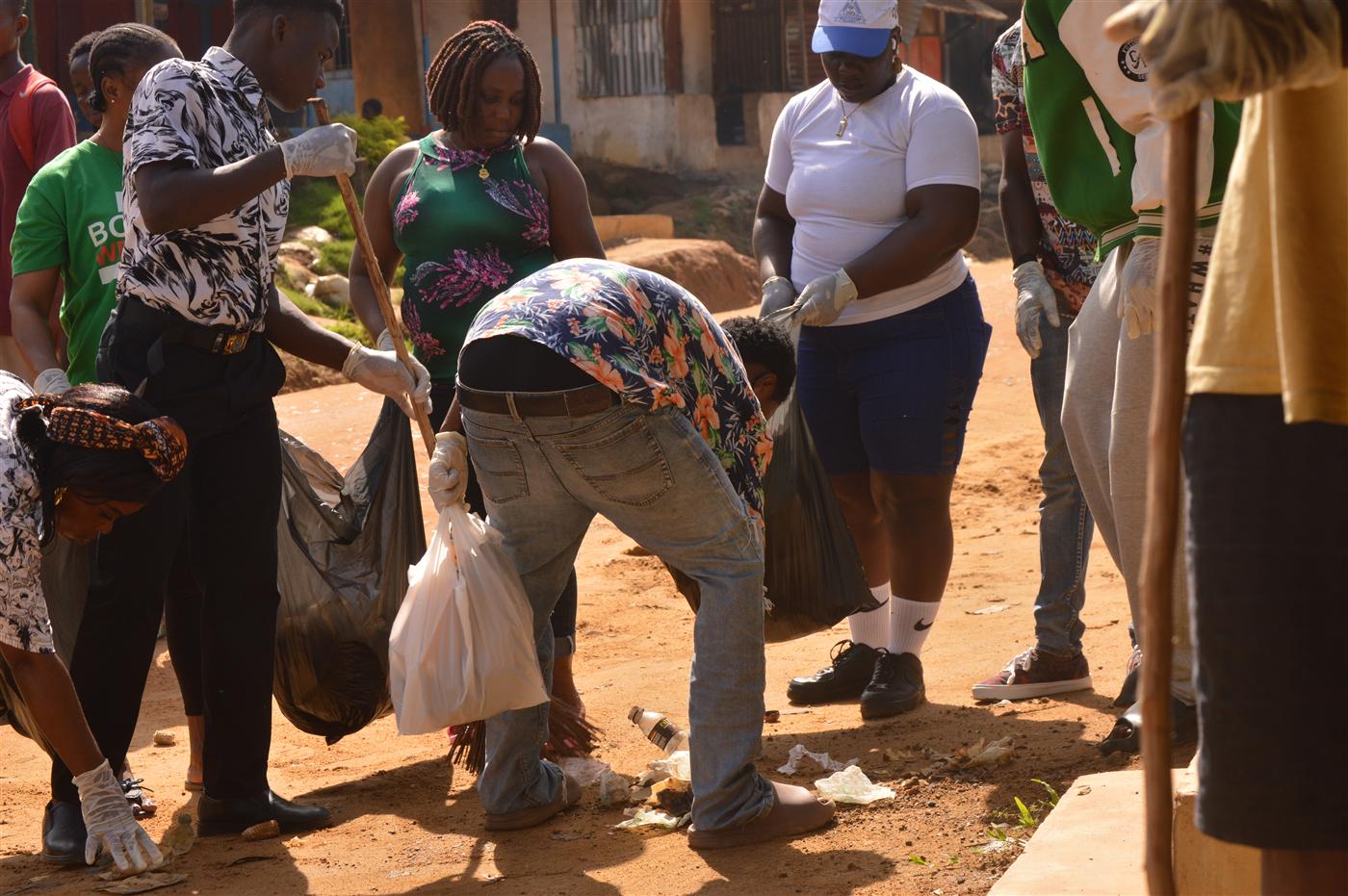 Participants removing waste from streets and public spaces as part of the World Environment Day observance.