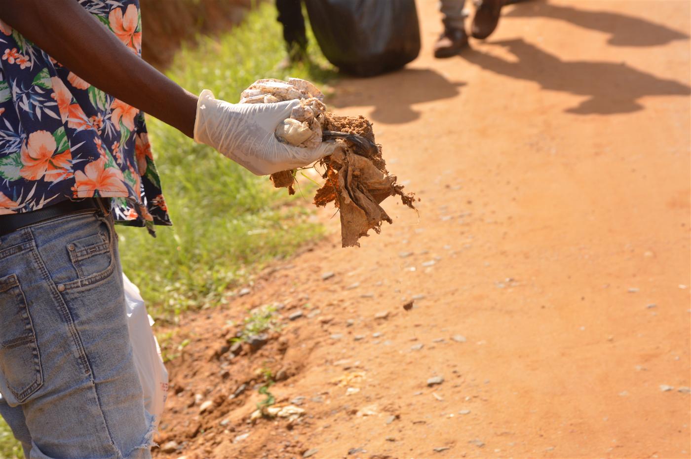 CRAF volunteers collecting waste and clearing public spaces during the community clean-up.