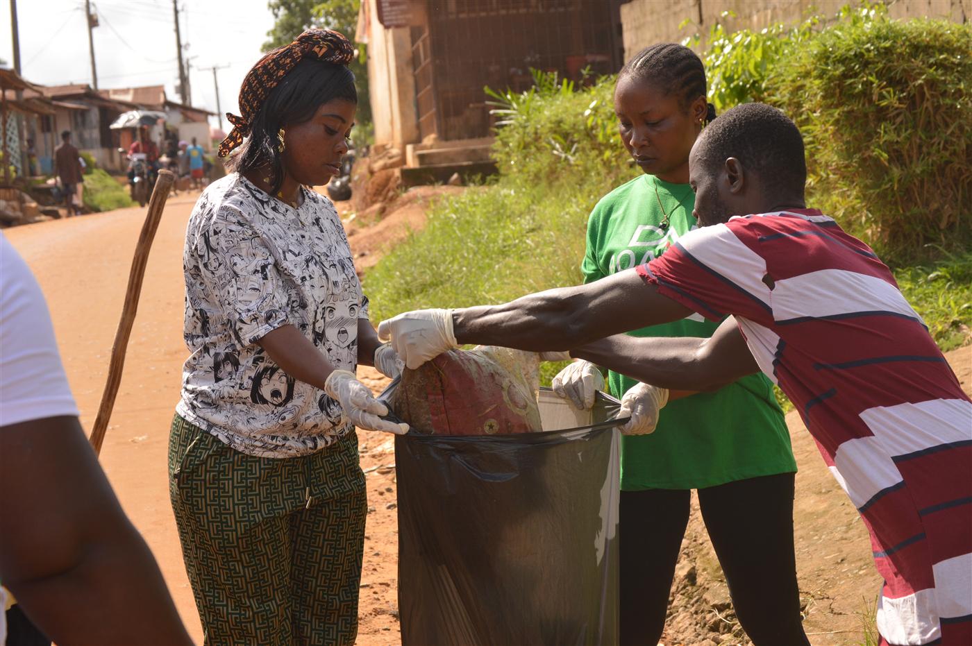 CRAF volunteers and community participants collecting waste during the clean-up exercise in Soul Clinic.