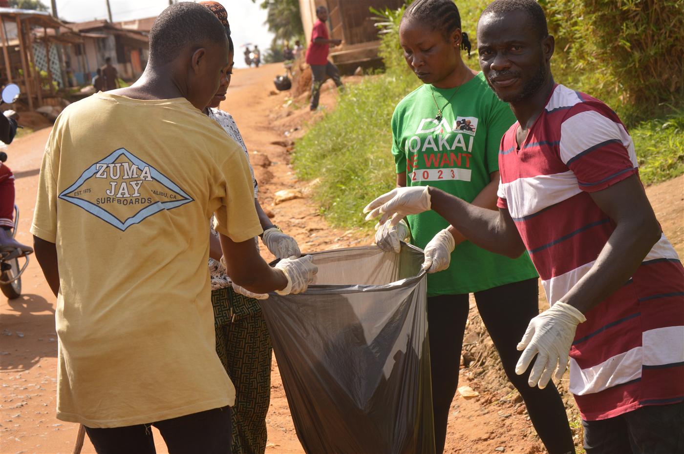 Volunteers working together to reduce waste and protect public health in Paynesville City.