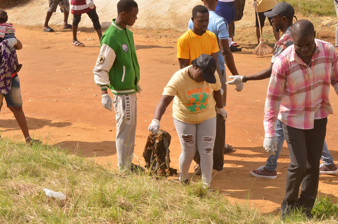 Volunteers collecting waste from roadsides and public spaces.