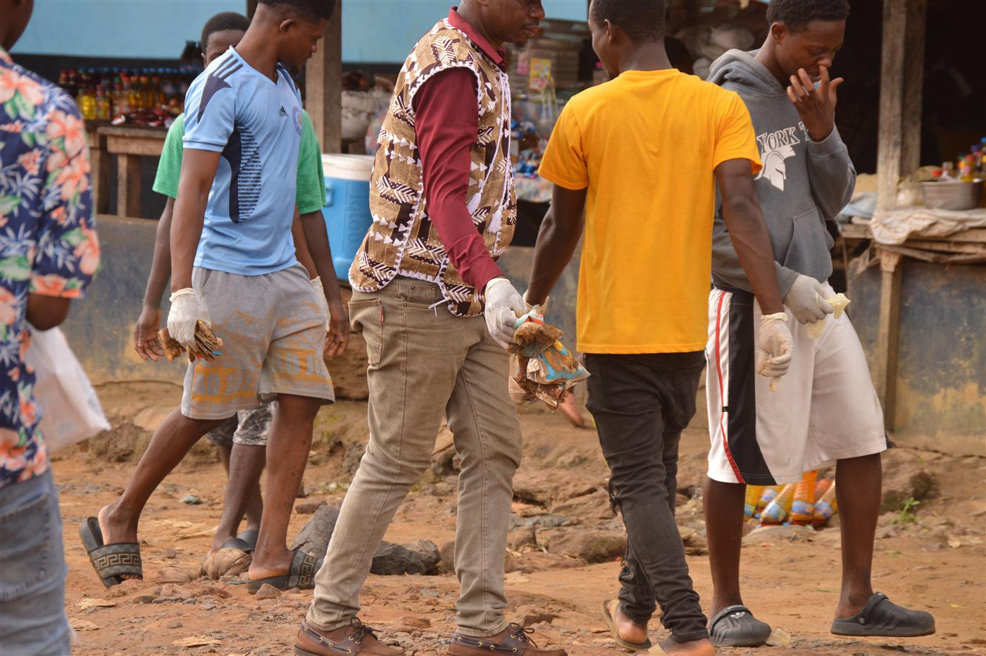 Young people helping clean public spaces during the World Environment Day activity.