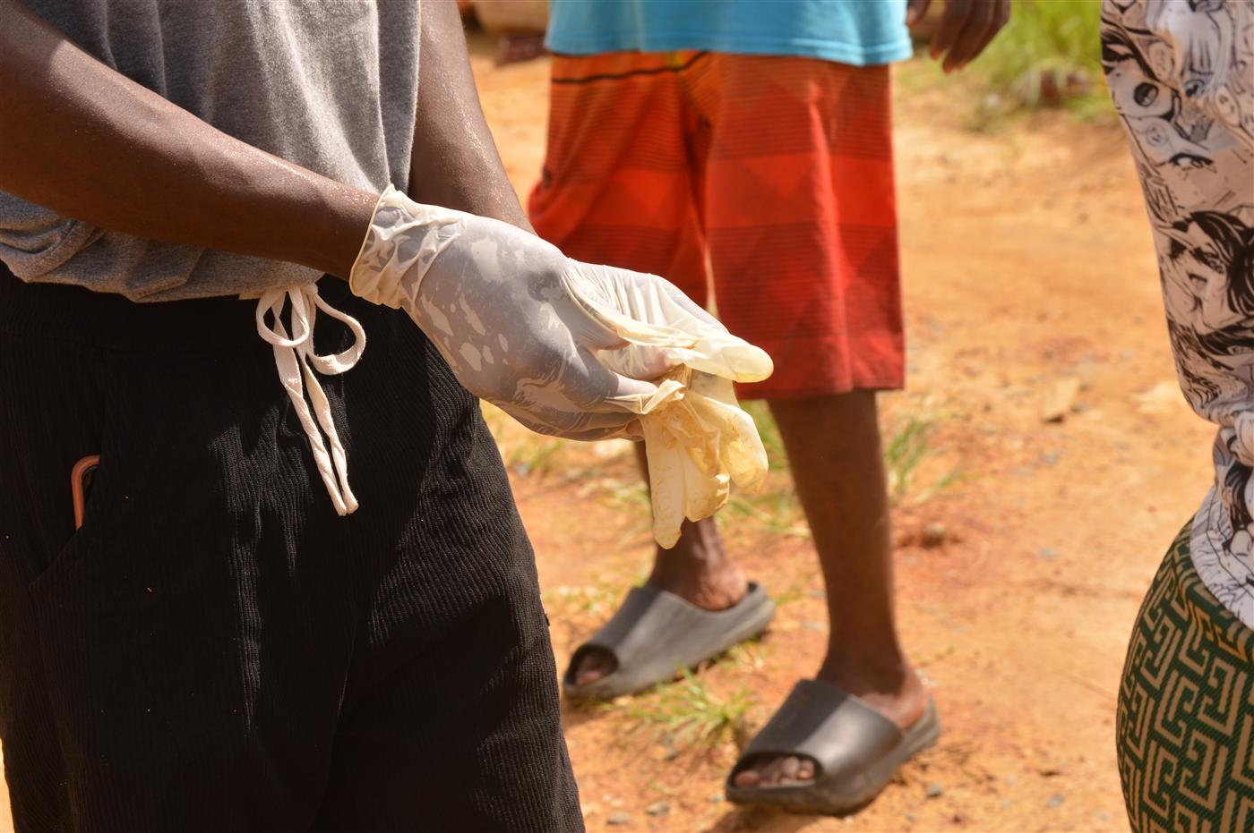 Participants preparing protective gloves before joining the clean-up exercise.