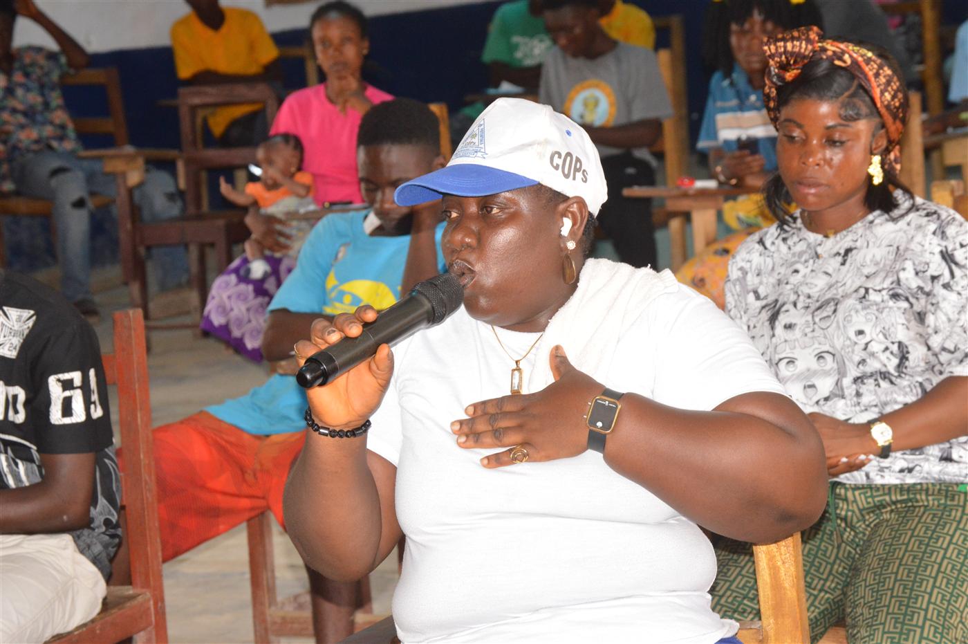 Community member asking a question during the environmental education session.