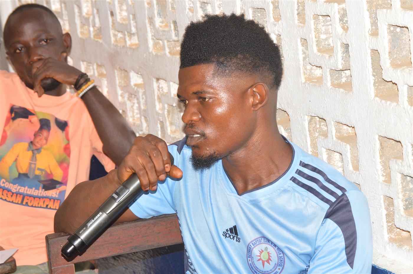 Young participant speaking during the World Environment Day dialogue.
